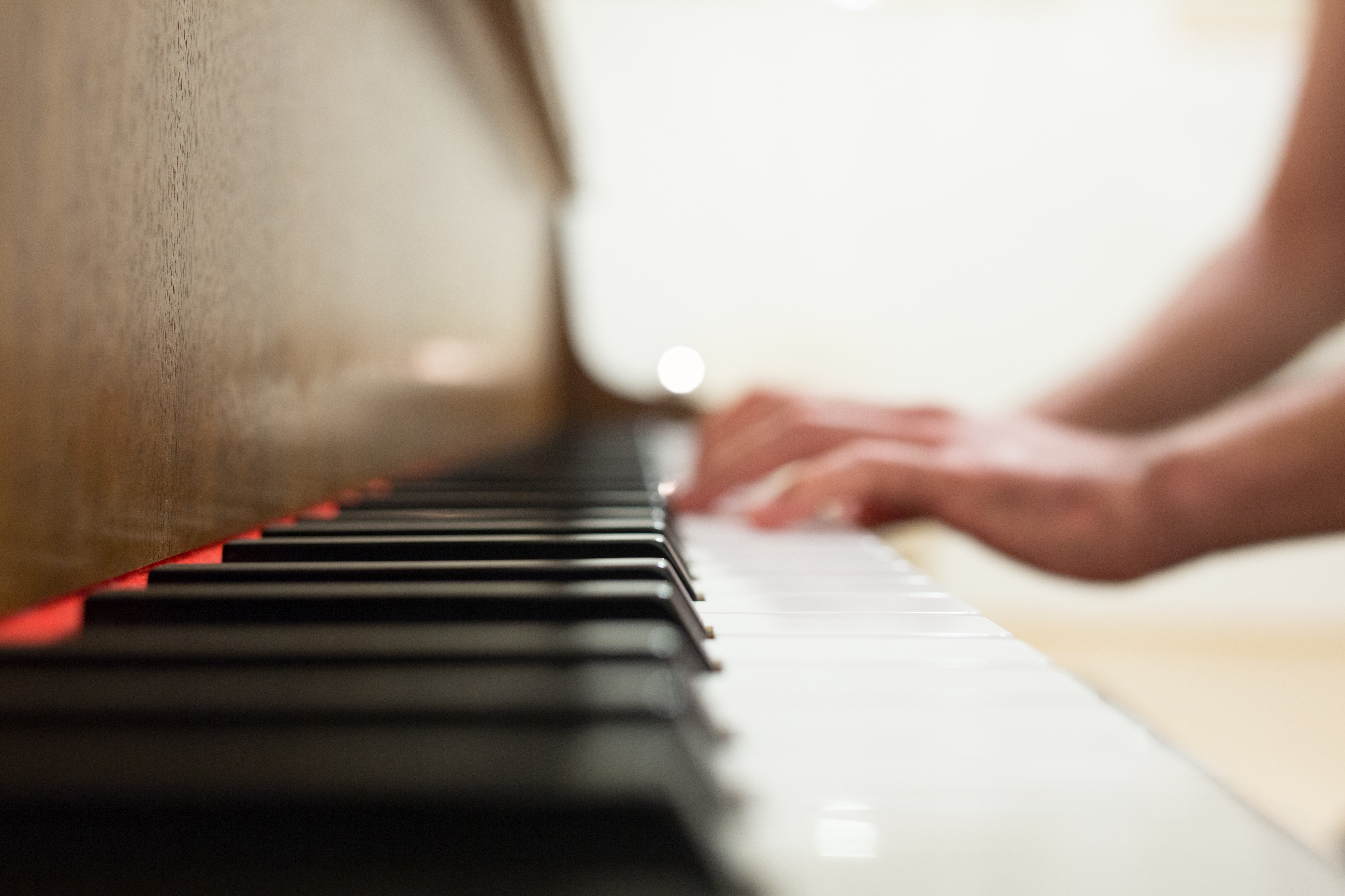 Student learning to play the piano