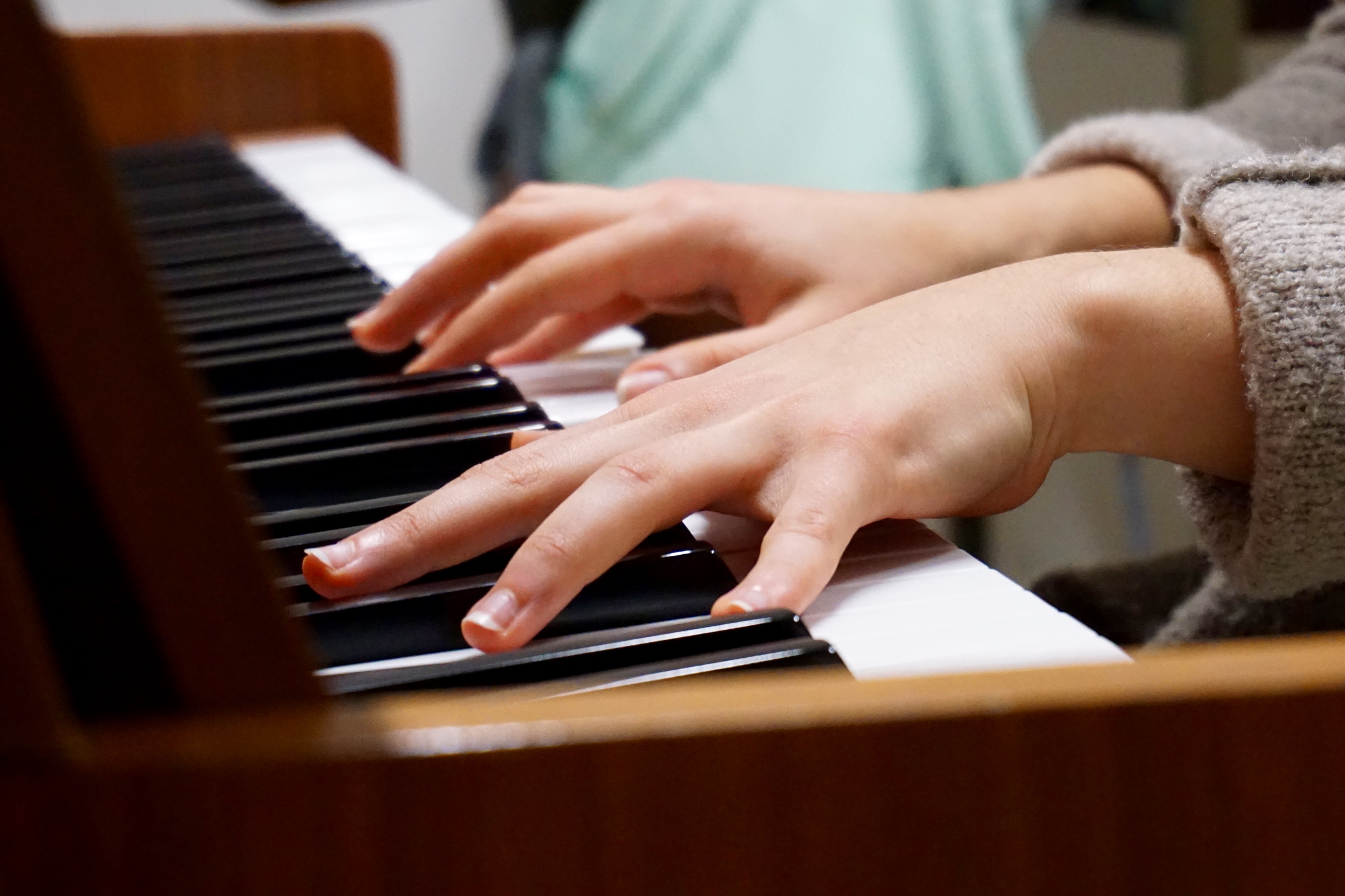 Student learning to play the piano